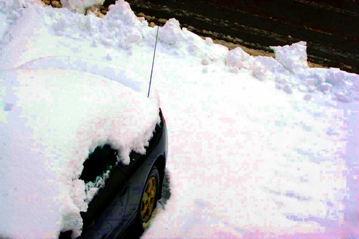 Snow Covered Car